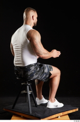 Whole Body Man White Sports Shorts Muscular Sitting Top Studio photo references